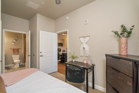 Furnished bedroom with view of kitchen