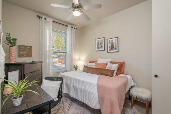 Furnished bedroom with large window