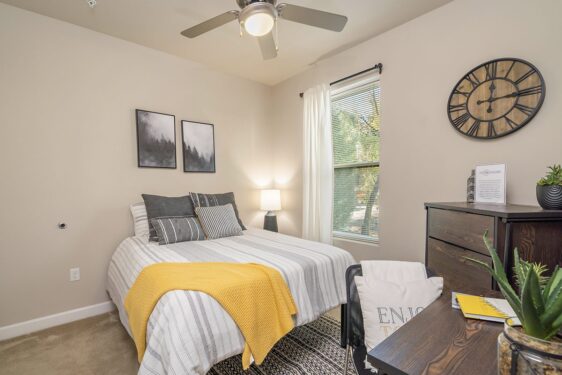 Furnished bedroom with large window