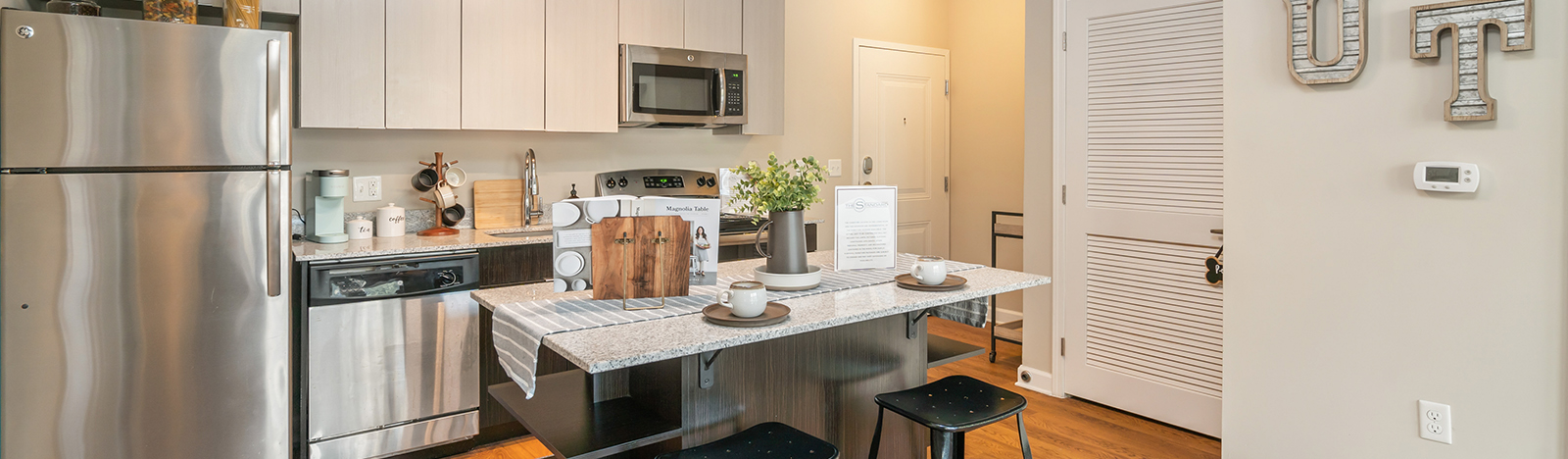 Furnished apartment kitchen with bar seating